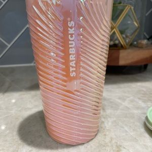 Starbucks iridescent color shift is a soft peach and green.